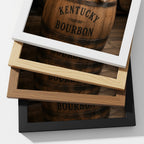 Four stacked picture frames in white, natural wood, espresso, and black, each displaying a photograph of a Kentucky Bourbon barrel.