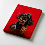 A gallery wrapped canvas featuring a black dog wearing a red polka-dot bow tie and smoking a cigar, with a glass of amber liquor on the surface, against a red background.