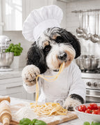 Custom pet portrait of a black and white dog in a chef hat preparing fresh pasta in a bright kitchen