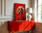 Framed dog artwork showing a shaggy dog in a red coat and heart sunglasses above a red cabinet beside a lamp